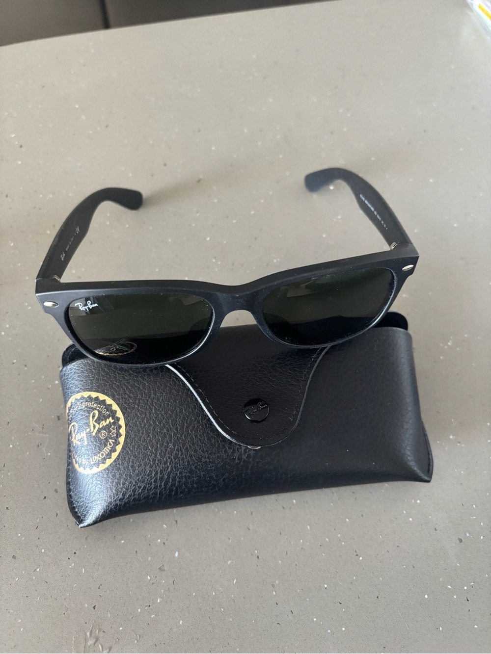 Ray-Ban Black Frame Sunglasses with Dark Green Lenses